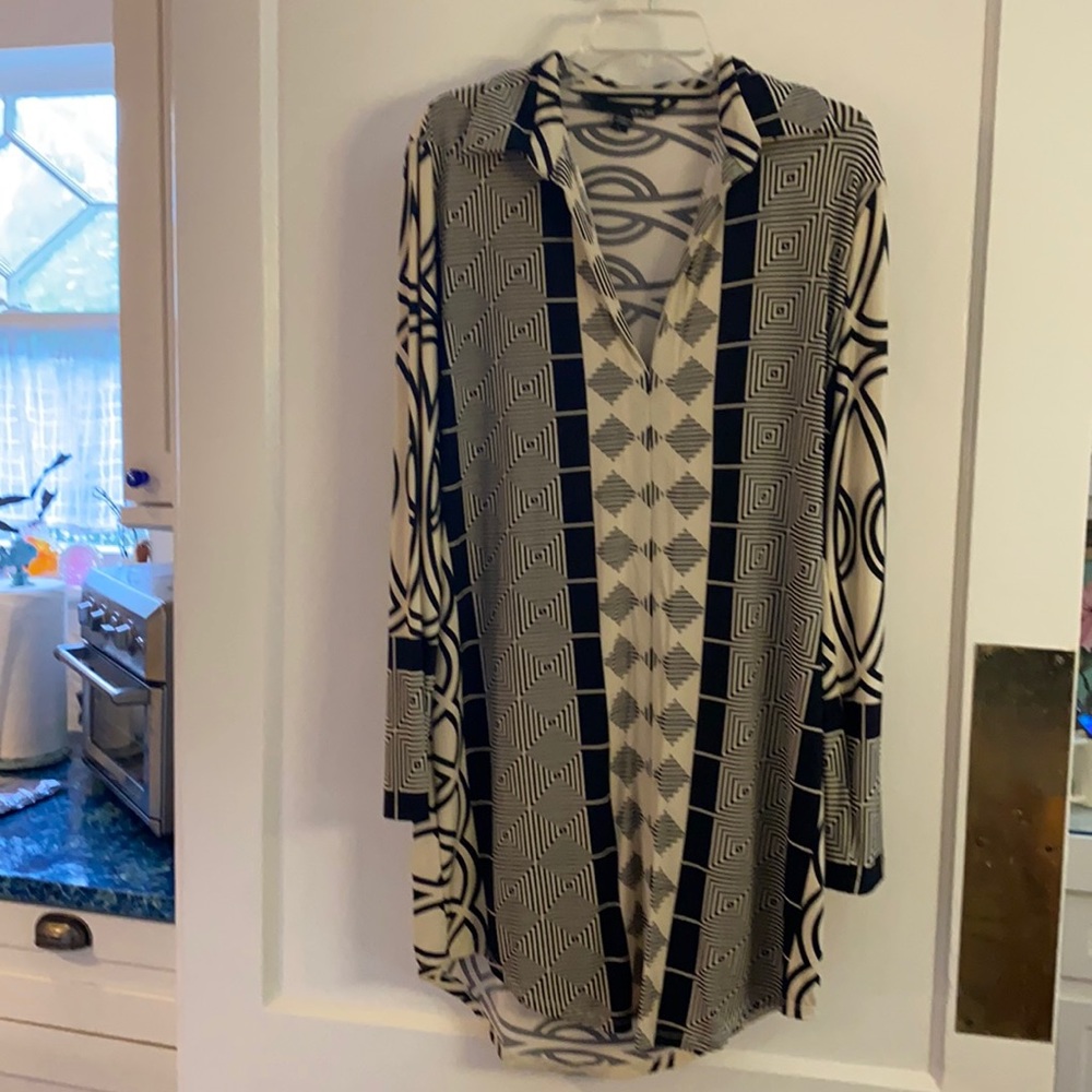 Classic style shift dress. Hem slightly longer In the back.